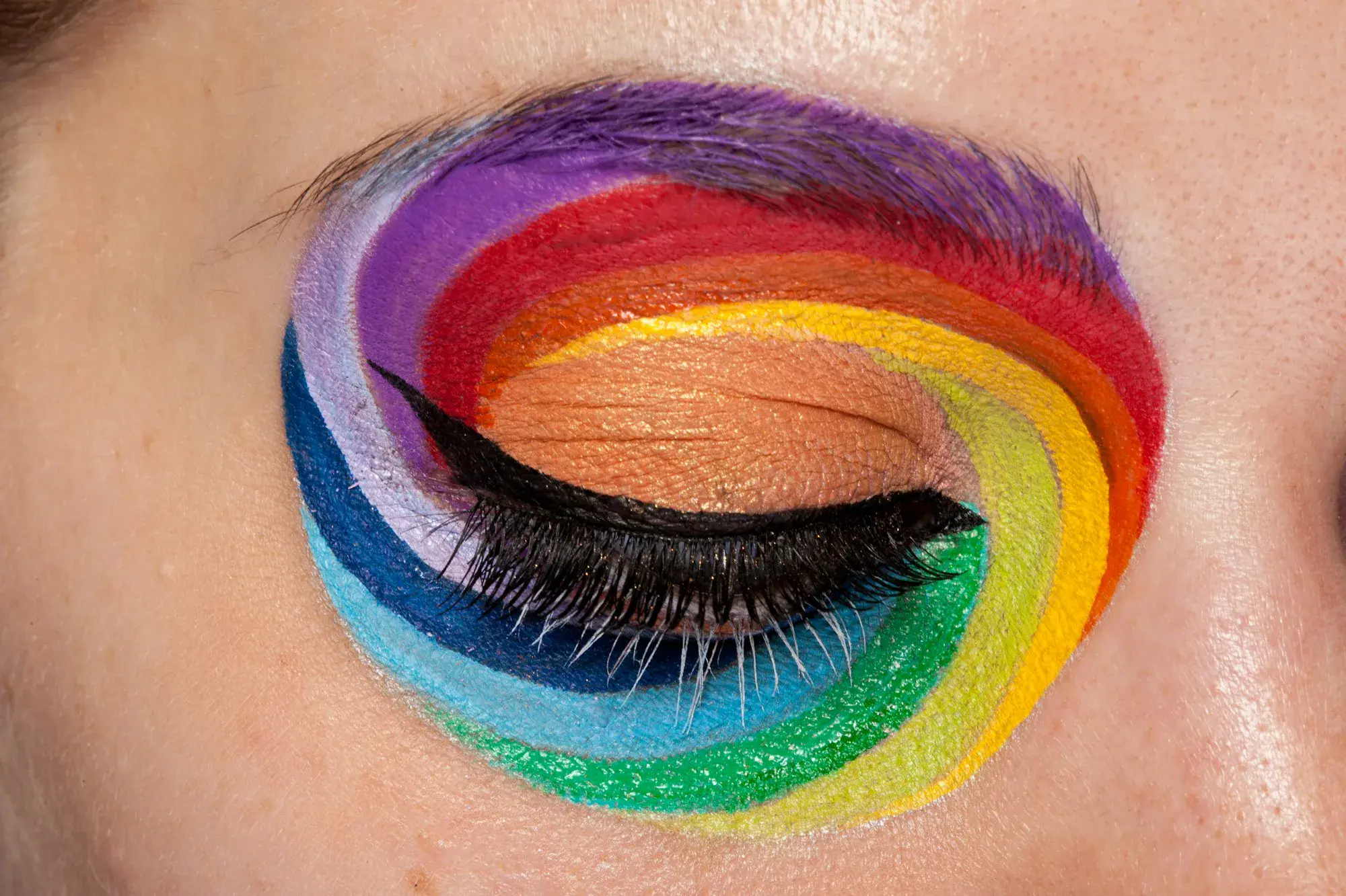 Rainbow colors in close up artistic make up